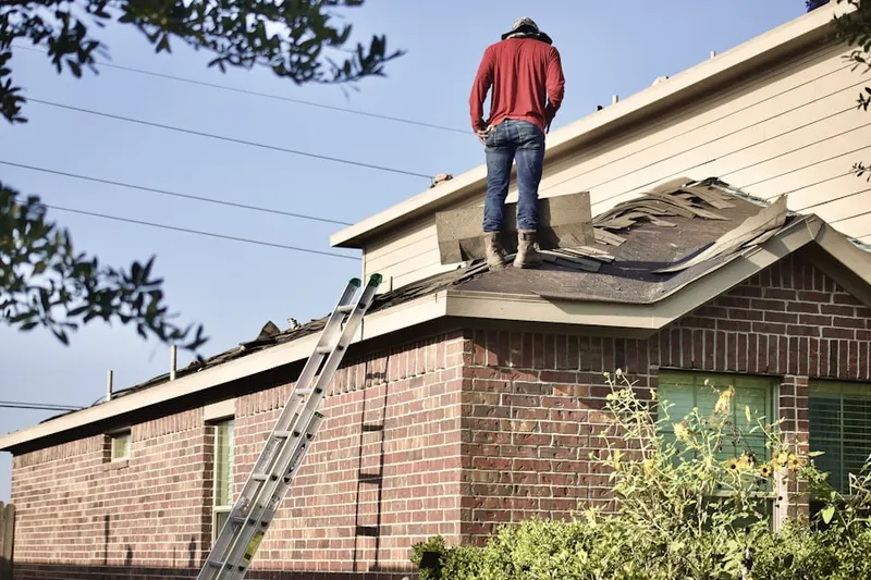 Professional roofer working on a residential roof in Saugus Canyon